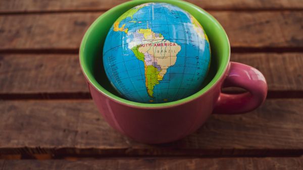 Globe in a Mug by Arturo A Cup with a small globe inside it