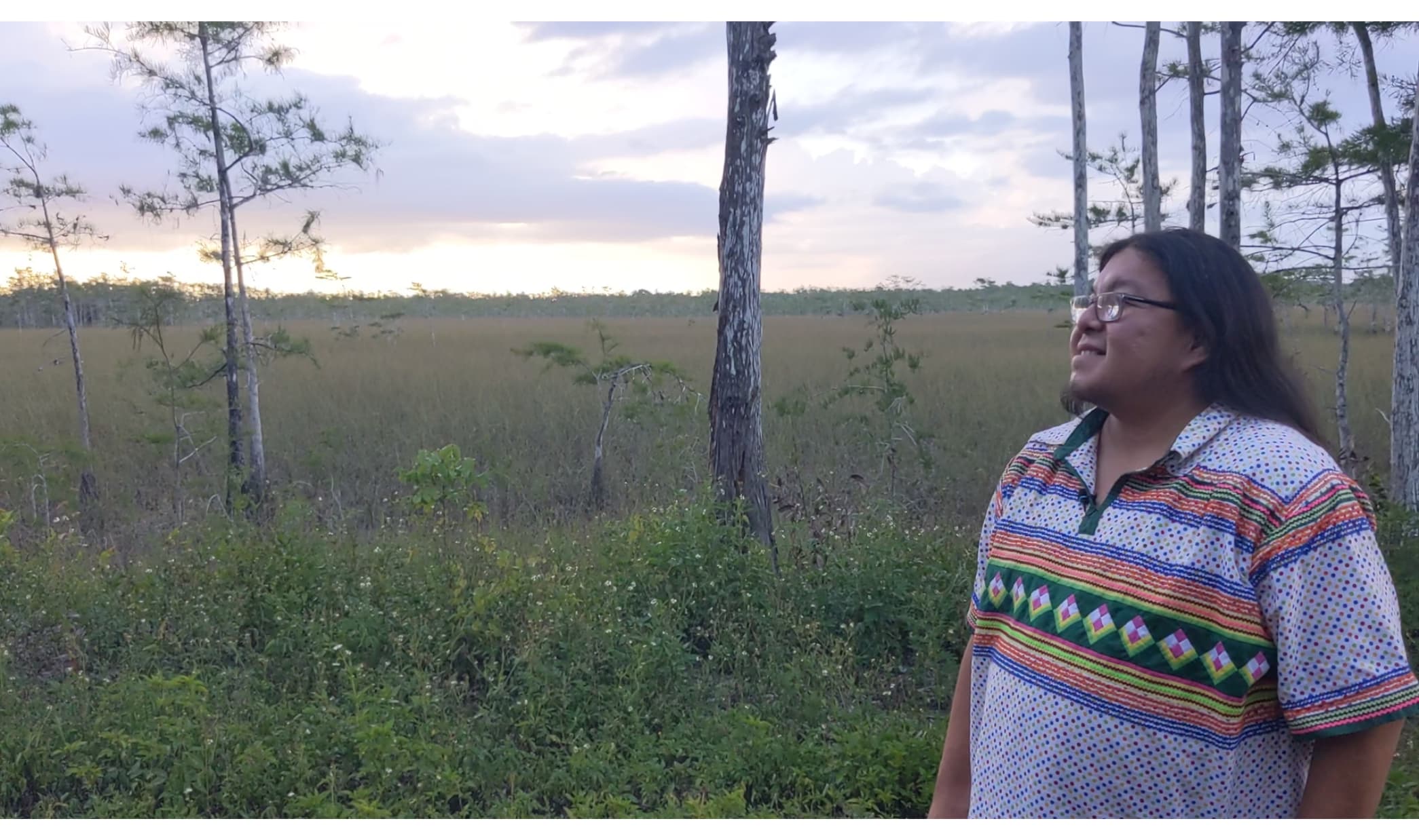 Photo of Rev. Houston Cypress stands in front of Everglades during sunset
