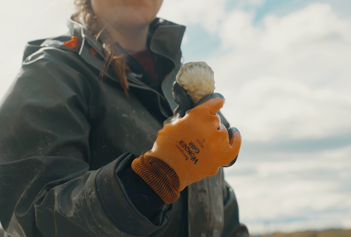 Amy holds up an oyster