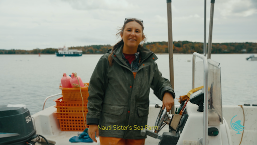 Alicia at the helm of their skiff.