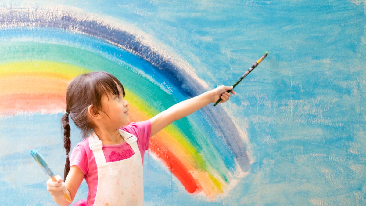 girl painting rainbow