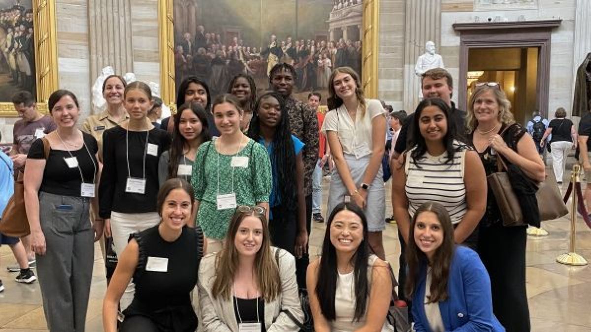 Group photo of the Young Changemakers Fellowship class of 2023–2024 inside the Capitol building.