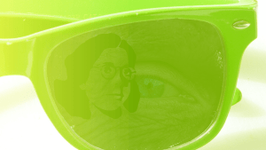 Image of glasses with reflections of a human eye and a graphic of a woman head.