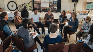 A group of high school students and resource professionals participate in an Open Space discussion on water issues. Image Credit: Andrea Holland Sears.