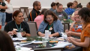 Four educators doing an environmental education activity at a PLT Training. Photo credit: PLT 