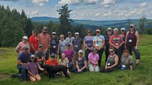 A group of educators gather at the Lundberg's property in Pittsburg, NH during the 2023 Forests of NH Teacher Tour to learn about wildife management techniques.