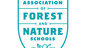 Badge shape with the writing "Eastern Region Association of Forest and Nature Schools"