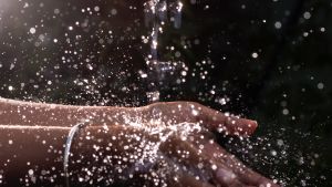 Human Hand Under Pouring Water