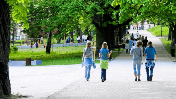 People strolling on a road in a park