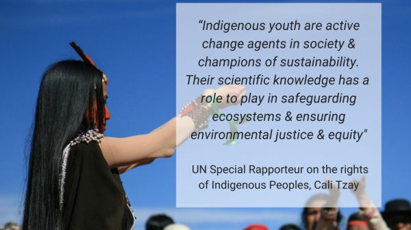 Group of Indigenous People gather outside on a sunny day. Light white transparency with black text says, "Indigenous youth are active change agents in society and champions of sustainability. Their scientific knowledge has a role to play in safeguarding ecosystems and ensuring environmental justice and equity."