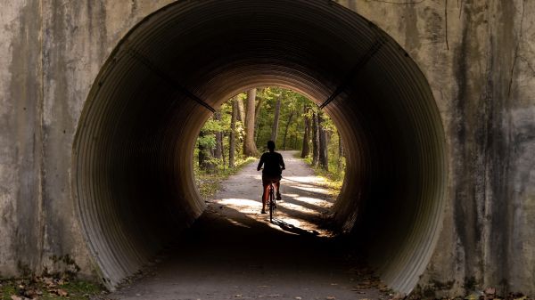 Bicyclist through a tunnel in Cuyahoga National Park.