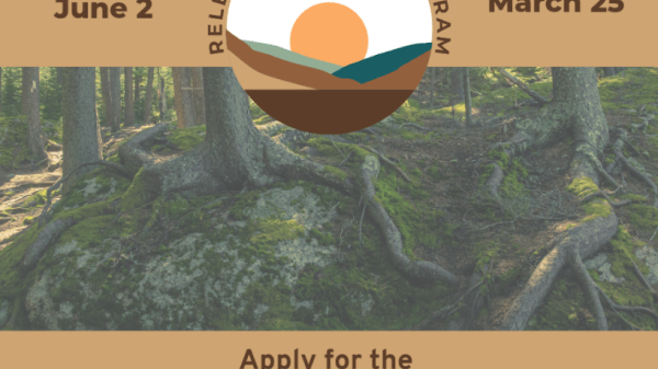 Forested background with light brown rectangle elements in the front. Brown text and a circle illustration of a sun rising above hills. Text in post.