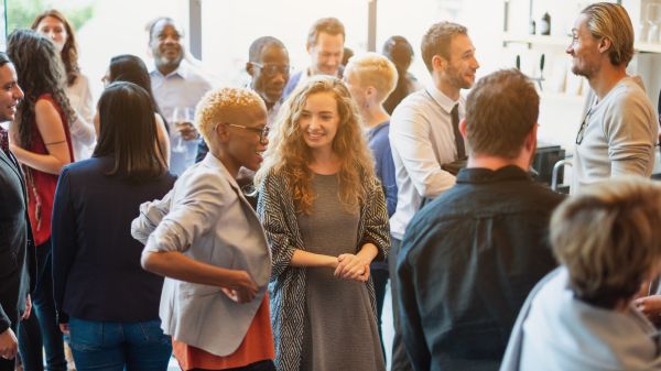 Group of people talking in a room.