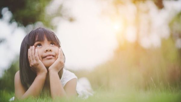 young girl looking up