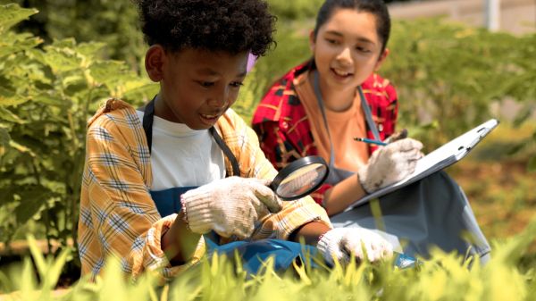 Two students in a garden