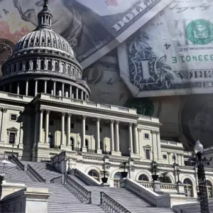 Photo of the U.S. Capitol with images of dollars in the background