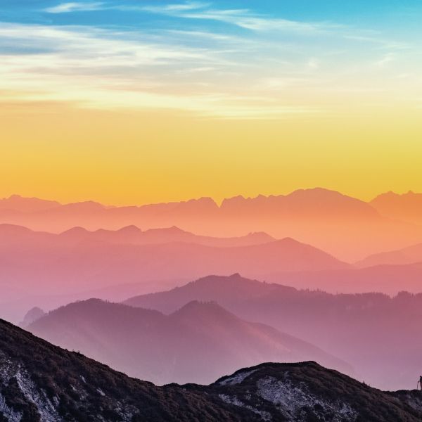A mountain range at sunset