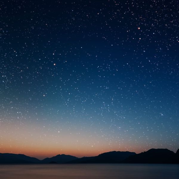 Landscape of night photo and body of water surrounded hills